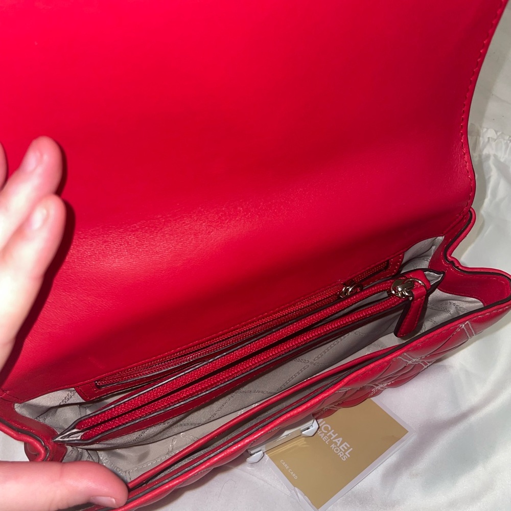 I am selling a barely used MK Crossbody bag. - Picture 2 of 6